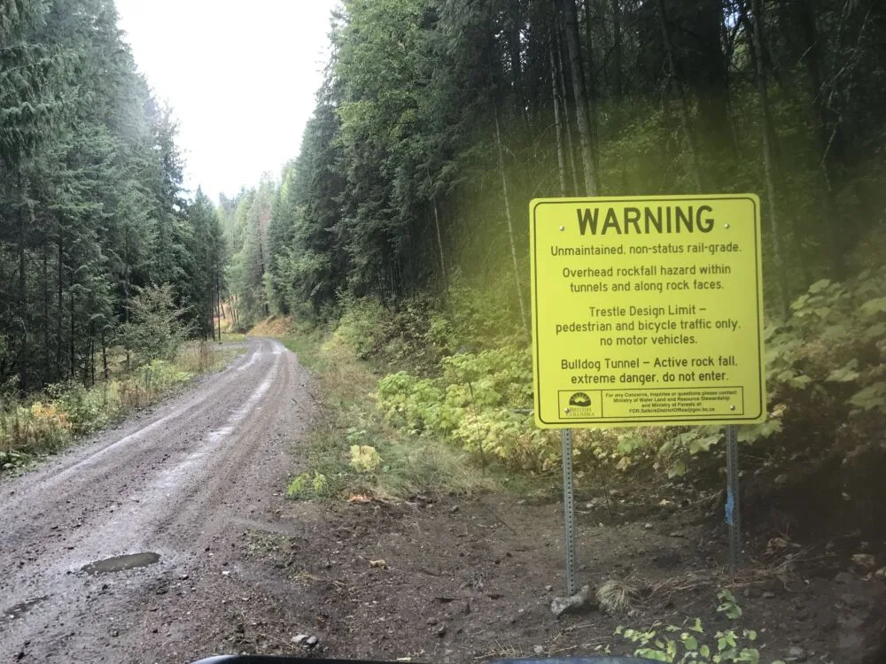 New warning signs installed when entering the section of the Columbia & Western Trail where the government has ended maintenance.